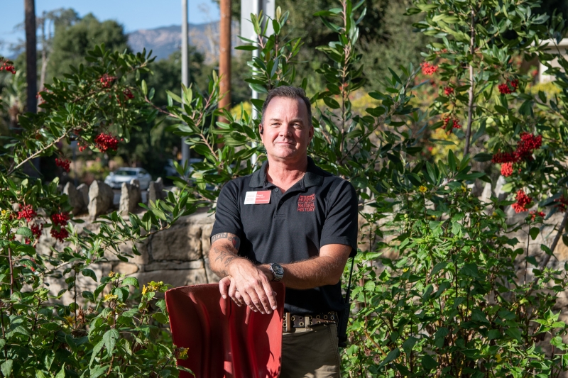 Our groundskeeper stands proudly amid the greenery he tends