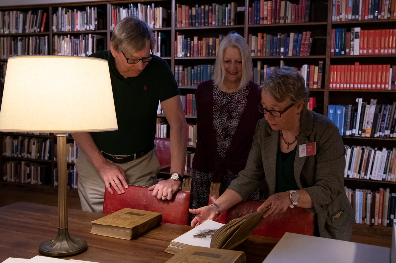 looking at rare books in the library