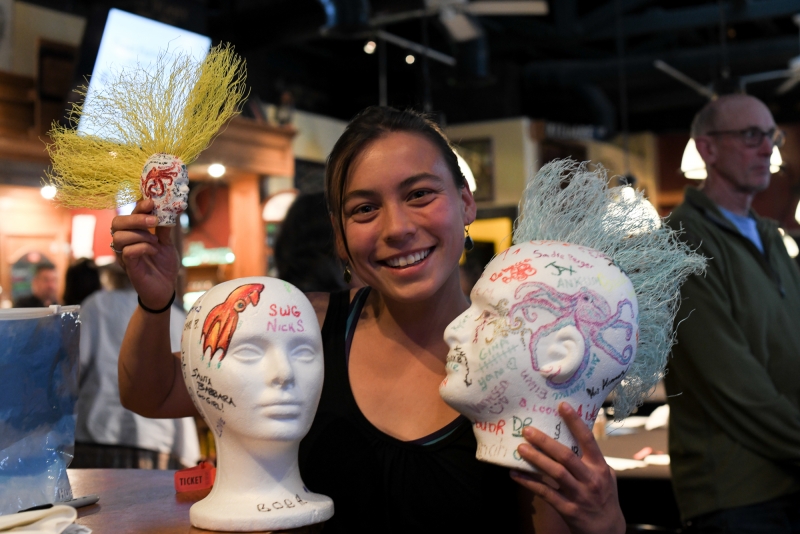 Science Pub attendee with styrofoam heads